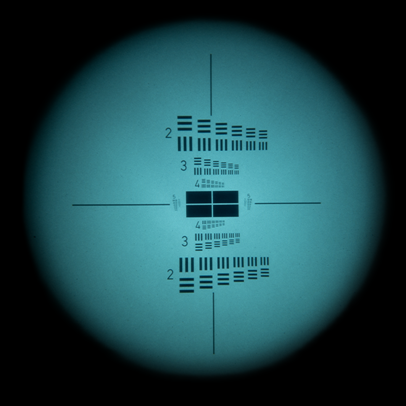 Lab night vision view through the Night Operators PVS-31 PRO showing measured resolution chart performance